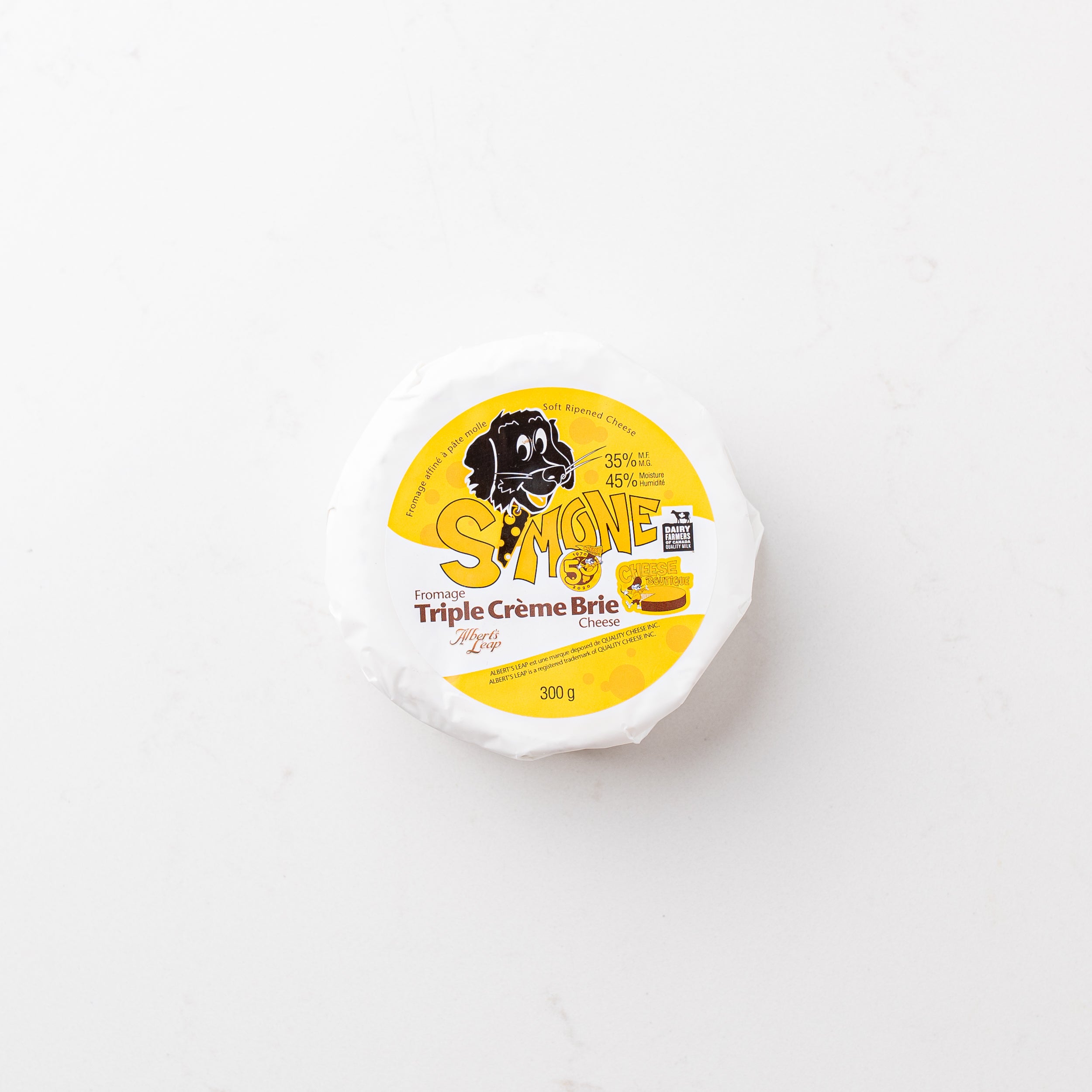 A block of cheese on a plain white background.