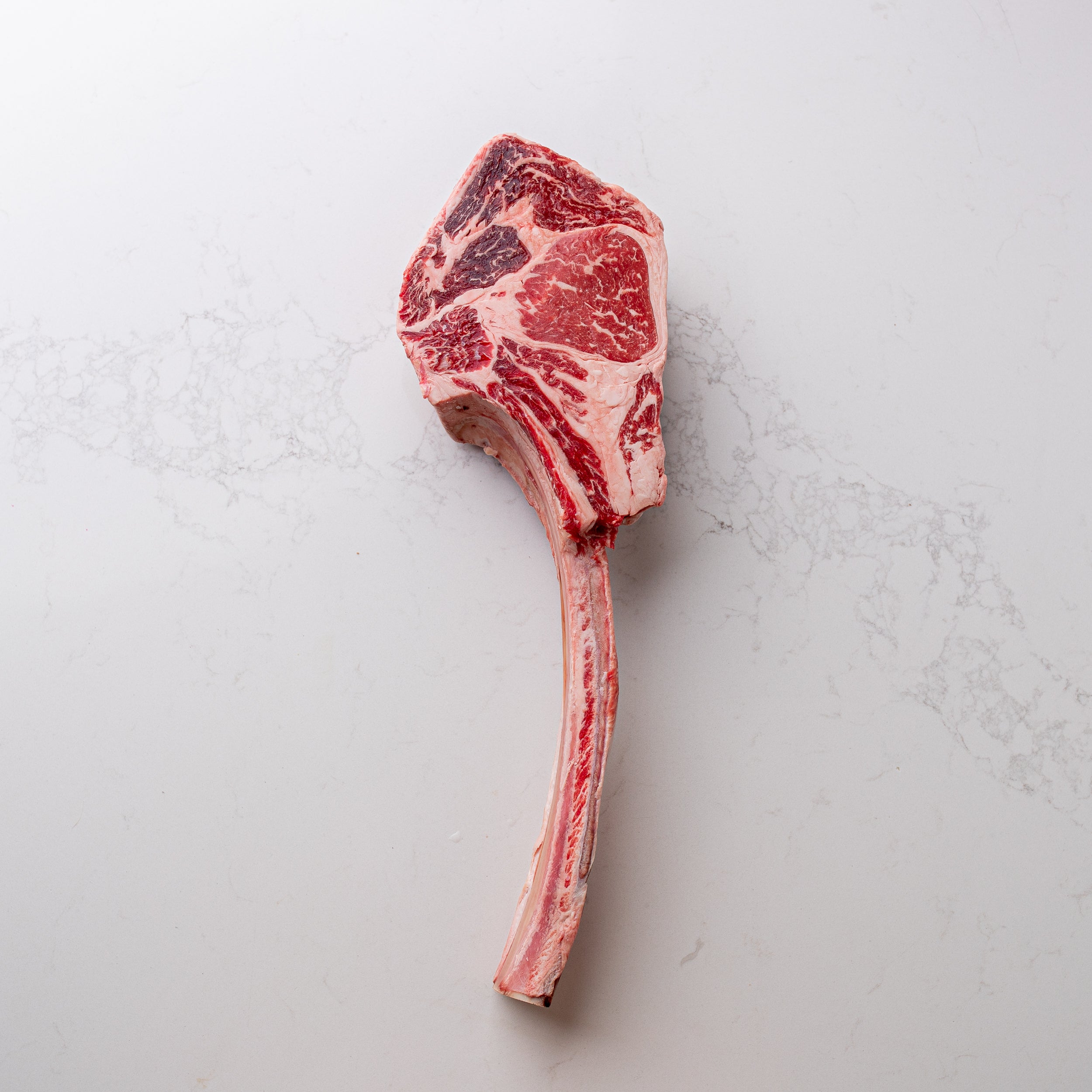 An appealing sight of a natural and locally sourced tomahawk steak, labeled as number 5, showcased at The Butcher Shoppe.