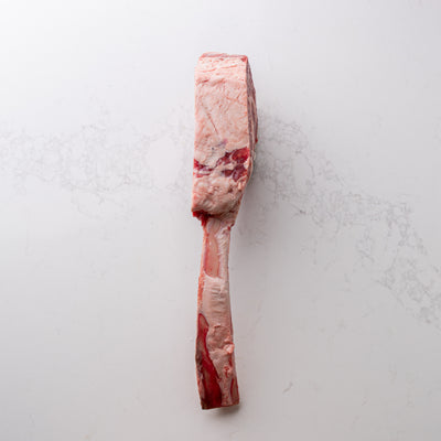 An appealing sight of a natural and locally sourced tomahawk steak, labeled as number 5, showcased at The Butcher Shoppe.