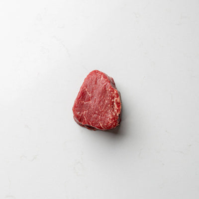 A prime cut of top sirloin steak, showcased at the butcher shoppe for direct purchase.
