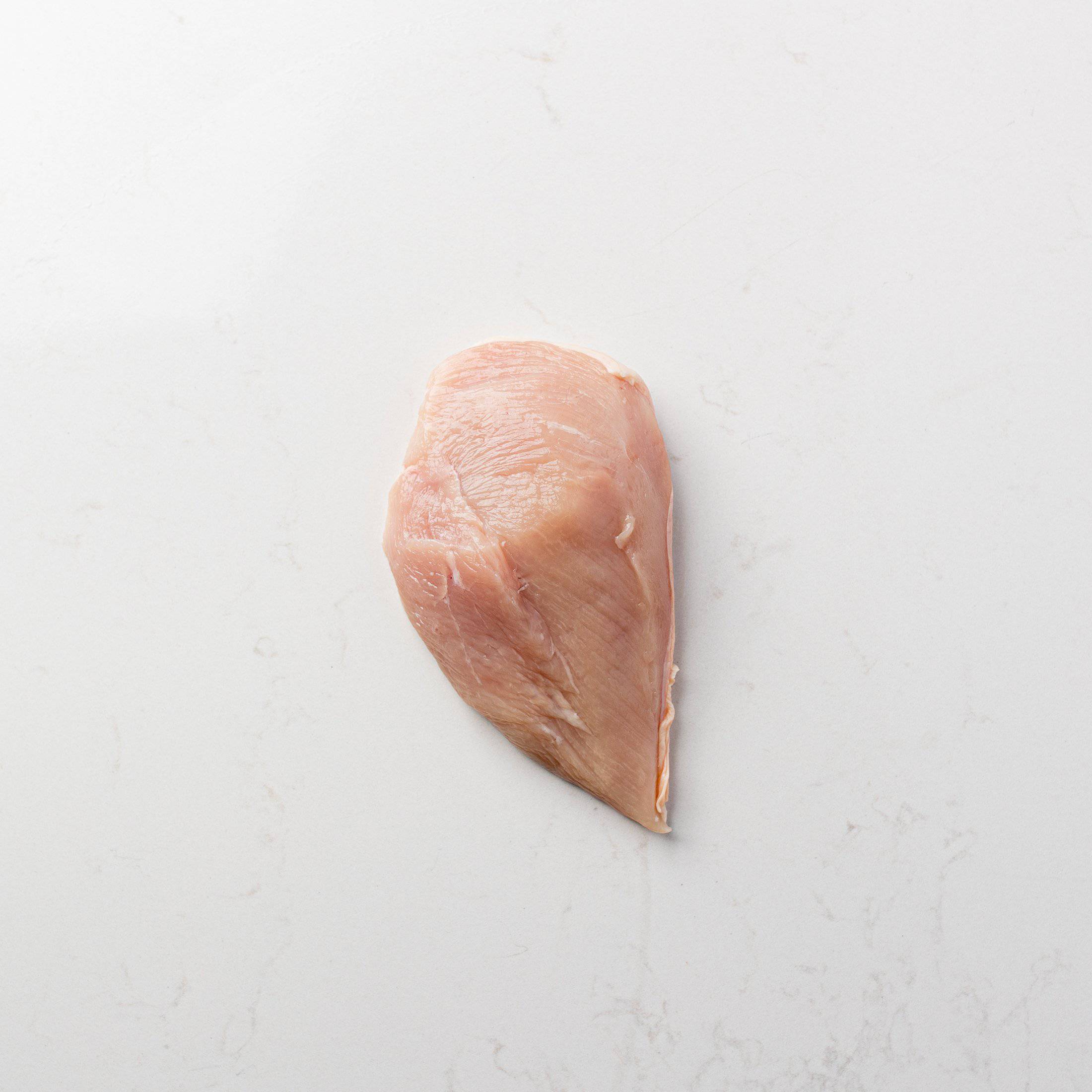 Meat Side of a Boneless Chicken Breast with Skin On from The Butcher Shoppe