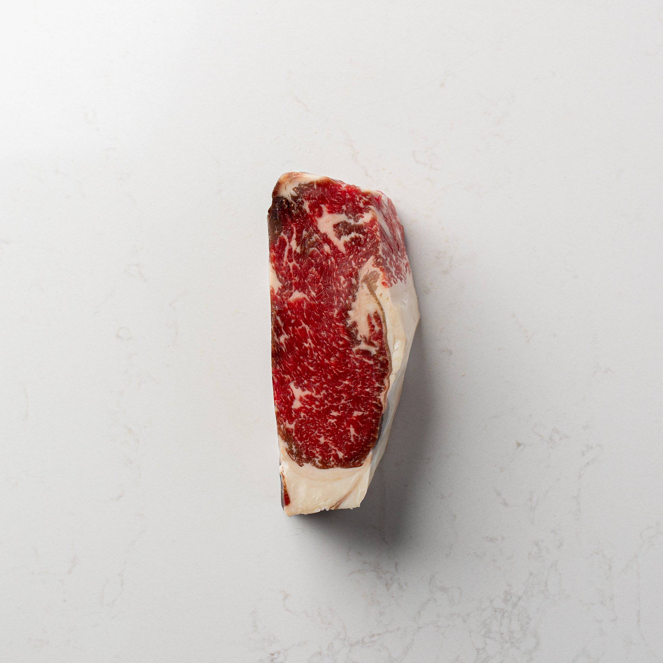 Marbling on a Dry Aged Prime New York Striploin Steak from The Butcher Shoppe