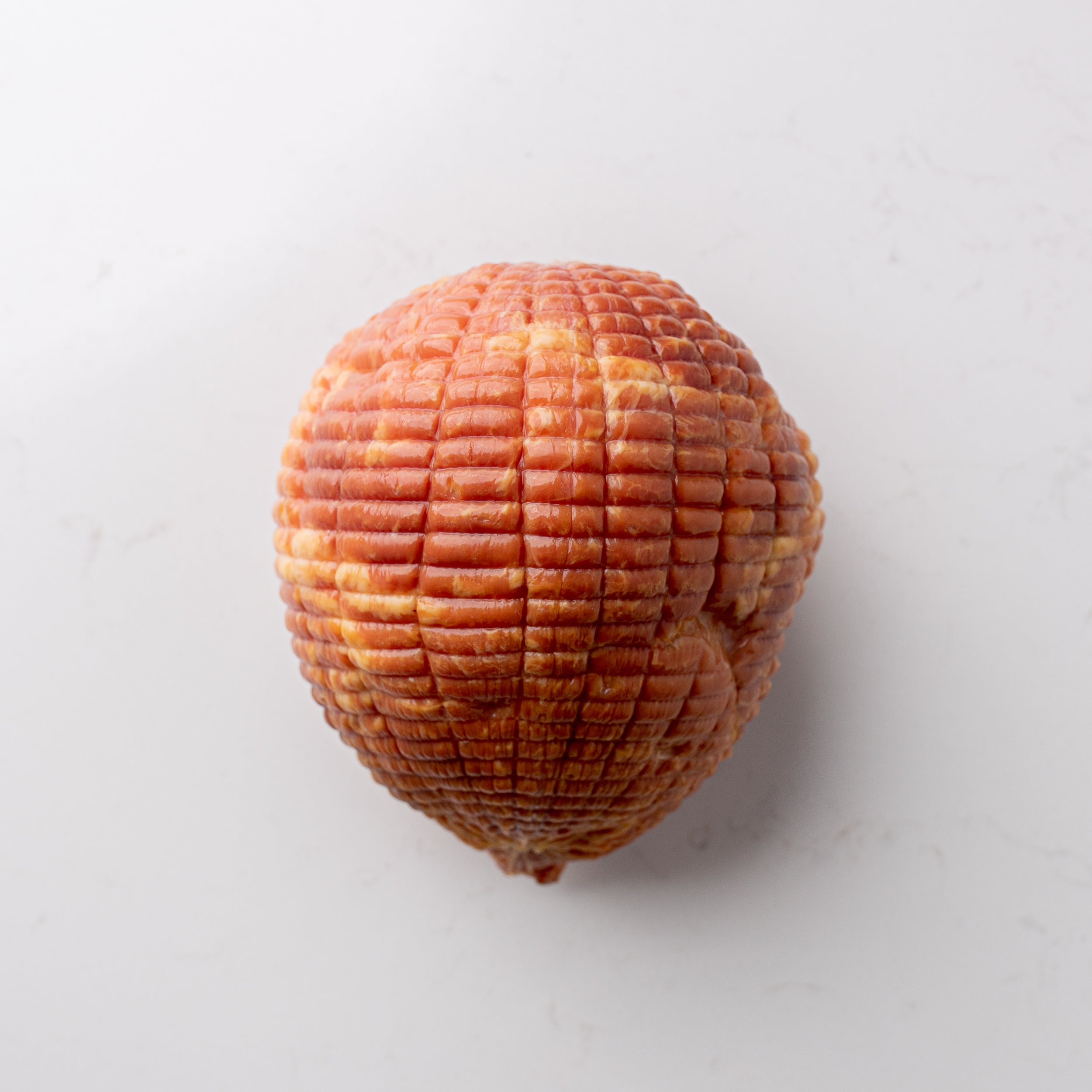 Delightful mini ham, a petite and flavorful option for a variety of culinary creations and occasions.